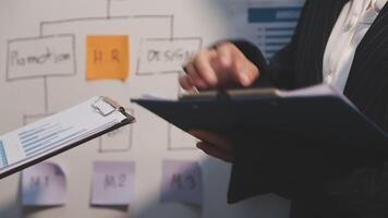 Finance manager meeting discussing company growth project success financial statistics, professional investor working start up project for strategy plan with document, laptop and digital tablet. video