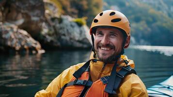 man is kayaking close-up. He smiles photo