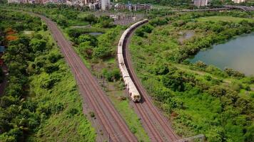 Aerial view of mumbai local train on railway tracks video