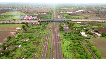 Aerial view of highway on railway track video