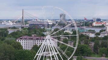 Construction of the observation wheel in Riga, Latvia. Beautiful ferris wheel in the Victory park in the center of Riga with a beautiful view of the old town. video