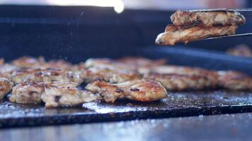 Grilling Chicken on BBQ Grill - Close-Up of Juicy Chicken Being Cooked Outdoors on Barbecue video