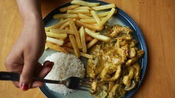 butter chicken, curry of spicy chicken with rice. video
