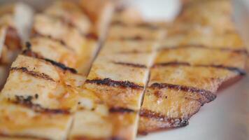 Closeup of grill chicken meat with fresh salad on a plate video