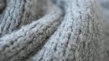 Closeup of grey knitted fabric texture with cozy details, creating a warm snug feel video