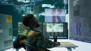 Government intelligence officers in control room manage surveillance operations, analyze real time data and coordinate security measures to protect national interests. Secret service. Camera B. video