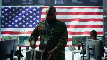 US military personnel work in a modern army command post, safeguarding classified information and state secrets against cyber attacks. Digital warfare and cybersecurity operations. Camera B. video