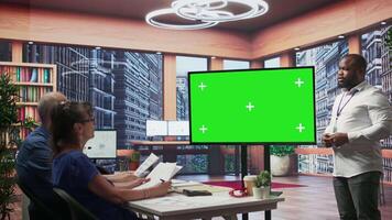 Elderly pair meeting with a financial broker next to copy space display, exploring retirement plan options and ensuring their pension for the future. Finances planning strategy. Camera B. video