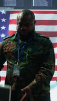 Vertical US military personnel work in a modern army command post, safeguarding classified information and state secrets against cyber attacks. Digital warfare and cybersecurity operations. Camera B. video
