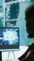 Vertical IT programming technician gathering information via neural network and artificial intelligence, employing programming language and new technology to help army operations. Deep learning. Camera B. video