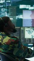 Vertical Government intelligence officers in control room manage surveillance operations, analyze real time data and coordinate security measures to protect national interests. Secret service. Camera B. video