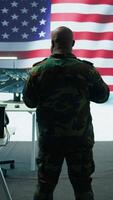 Vertical Team of military experts operates high tech computers and tablet to analyze surveillance data and manage national security operations. Working with CCTV radar satellite imagery. Camera B. video