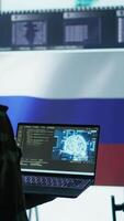 Vertical Russian IT expert uses new technology machine learning to spread fake news and cyber war propaganda, making national threats via neural network digital science. Army stealing information. Camera B. video