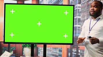 Elderly pair meeting with a financial broker next to copy space display, exploring retirement plan options and ensuring their pension for the future. Finances planning strategy. Camera A. video