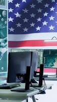 Vertical Empty operations center with an American flag working on national safety, armed forces protecting the country with anti terrorism tactics. Military control and command room headquarters. Camera A. video