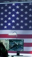 Vertical US military officer supervising threat detection activity in high tech office, examining top secret data on big screen. American army soldiers managing hybrid war, cyber attack prevention. Camera A. video