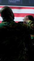 Vertical American army officers in a high tech command center monitor cybersecurity threats, manage classified information and state secrets. Hybrid warfare strategy for the government. Camera A. video