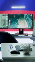 Vertical Empty mission control center with the russian flag on big screen, dealing with fake news and a terrorist attack with high tech gear. Spreading misinformation and controlling the people. Camera A. video