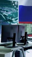 Vertical Empty army command post with the russian flag running on big screen, russian federation and government working on propaganda to spread fake news among the population. Camera A. video