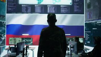 Army IT expert in control center collecting real time battlefield data, process satellite surveillance imagery for successful military defense mission. Using green screen isolated display. Camera A. video