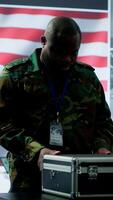 Vertical American military officers in cyber command center protect state secrets, manage classified information and engage in high tech digital warfare to ensure cybersecurity and data protection. Camera A. video