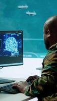 Vertical Cloud computing expert using new technology AI brain to learn intelligence for national defense missions, operating laptop to gather information from cctv systems. Neural network. Camera A. video