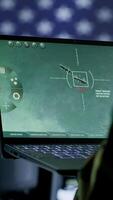 Vertical Intelligence officers in american military uniforms work on computers in a command post, managing surveillance and data analysis. Support global operations for the US government. Camera A. video