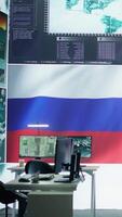Vertical Empty military command center drone control agency with the russian flag on big screen, spreading misinformation and fake news to scare the population. Russian federation army. Camera B. video