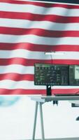Vertical Empty military control center with a big screen shows the American flag, secret service agency protecting the country from threats. Army command room with high tech equipment. Camera B. video
