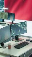 Vertical Empty monitoring room equipped with the chinese flag on big screen using surveillance satellite systems to spread fake news about communism. Work on propaganda and terrorism. Camera B. video