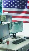 Vertical Empty operations center with an American flag working on national safety, armed forces protecting the country with anti terrorism tactics. Military control and command room headquarters. Camera B. video