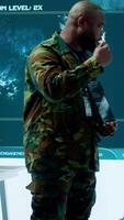 Vertical Military officer leads cybersecurity efforts in a high tech control center, ensuring data protection and managing surveillance systems, Coordinating national security operations. Camera A. video