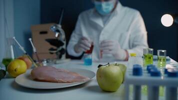 Scientists are testing genetically modified fruits, vegetables, meat for quality, presence of toxins, antibiotics and GMOs in the laboratory. DNA engineering industry. Bio engineering concept. video