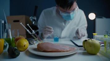 Bioengineering concept. Meat, vegetables and fruits are genetically modified food. Genetically modified food, biotechnology dna manipulation laboratory. Scientist proceeding quality control in lab. video