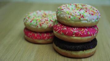 Donuts of different colors are stacked on top of each other video