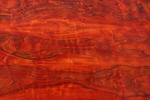 Padauk wood grain has a distinctive, rich texture with vibrant color variations photo