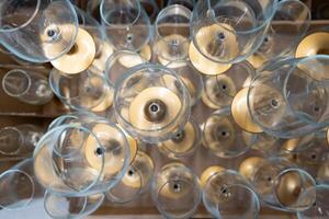 A lot of empty wine glasses. Top view of the pyramid of wine glasses. photo
