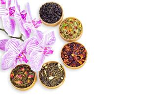 different types of tea on a white background. a kind of delicious tea, fruit tea. top view. place for text, isolated on white photo
