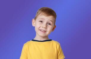 portrait of a little boy with the emotion of misunderstanding, surprise thoughts photo