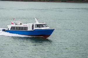 Batam, Indonesia - 8 July 2024. view of a passenger speed boat traveling fast photo