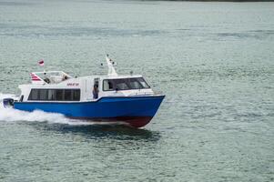 Batam, Indonesia - 8 July 2024. view of a passenger speed boat traveling fast photo