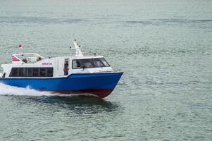 Batam, Indonesia - 8 July 2024. view of a passenger speed boat traveling fast photo