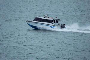 Batam, Indonesia - 8 July 2024. view of a passenger speed boat traveling fast photo