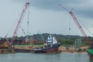 Batam, Indonesia. June 29, 2024. the process of raising the tugboat to the docx where maintenance will be carried out photo