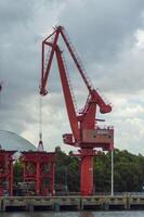 Batam, Indonesia. 7 July 2024. Grab crane, a tool used for loading and unloading cargo from ships. photo