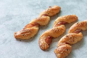 Homemade bacon bread twists on stone background, space for texture photo