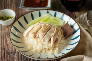 Hainanese Chicken rice with salted soya beans sauce and soup photo