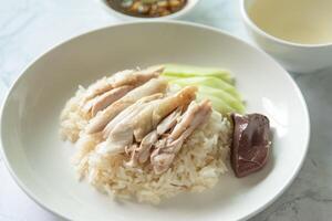 Closed up Chicken rice as Singapore street food with salted soya beans sauce and soup photo