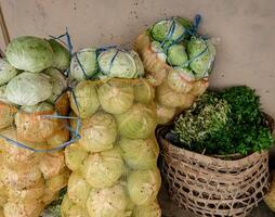 vegetables in sacks ready to be distributed to traditional markets photo