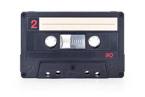 Audio cassette tape - old vintage compact audio cassette isolated on white background, with clipping path photo